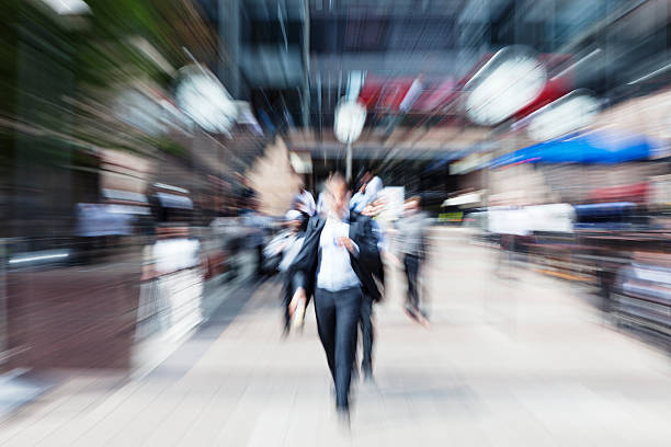 istock Businessman Walking in Financial District, Drinking Coffee, Blurred Motion, London 455215267