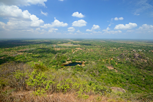 Wide angle view of central Sri Lankan plain, meadows, hills and rain forest, taken from Mihintale hilltop.