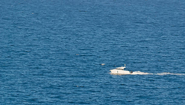 istock white motorboat and blue sea 455231877