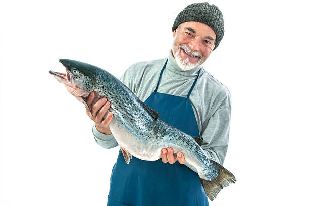 istock Smiling fisherman holding a big Atlantic salmon 455237471