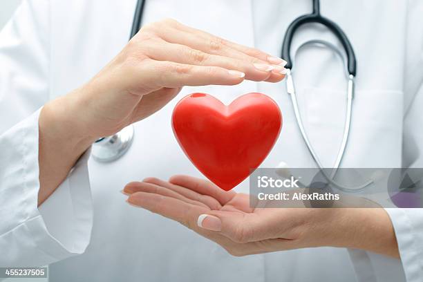 Doctor Holding Heart Stock Photo - Download Image Now - Heart Shape, Doctor, Cardiologist
