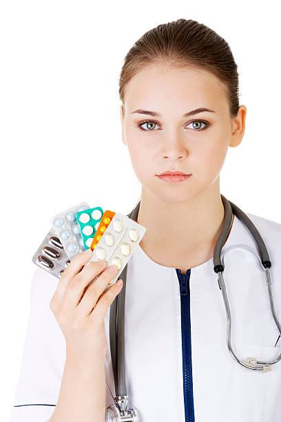 istock Beautiful young doctor,nurse holding pills. 455237777