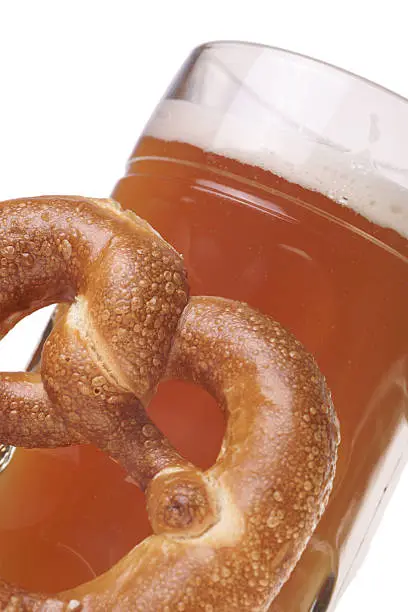 Beer mug with wheat beer and pretzel