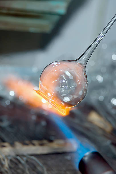 istock Flame and melting glass piece 455245859