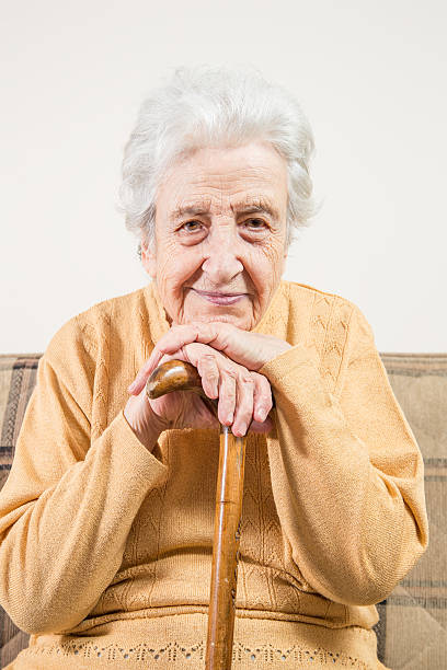 istock senior woman holding cane 455246661