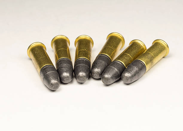 istock .22 caliber Long rifle Rimfire Ammunition on white 455248817