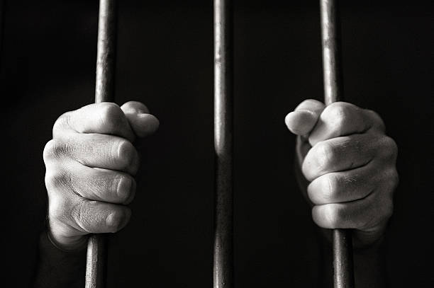 Hands holding the bars stock photo