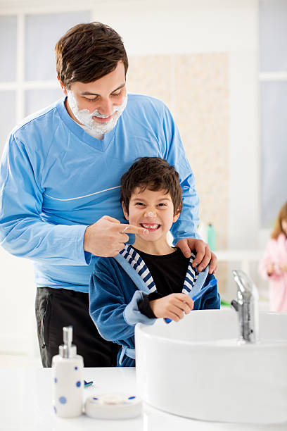istock Father and his son shaving in the bathroom. 455255003