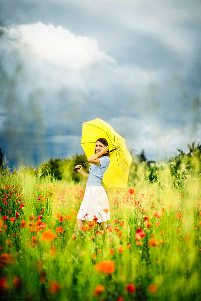 istock Woman in poppy fields 455257039