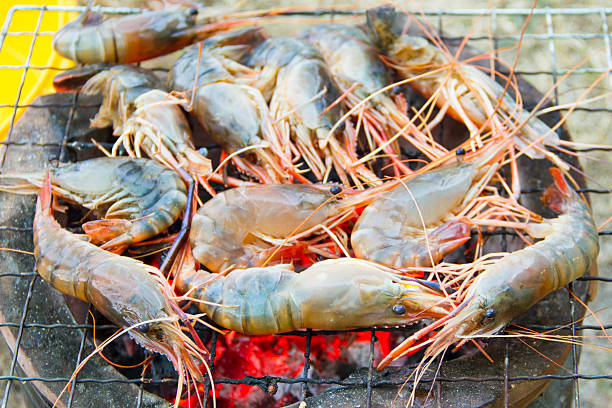 istock Shrimps grilled on charcoal oven 455273117