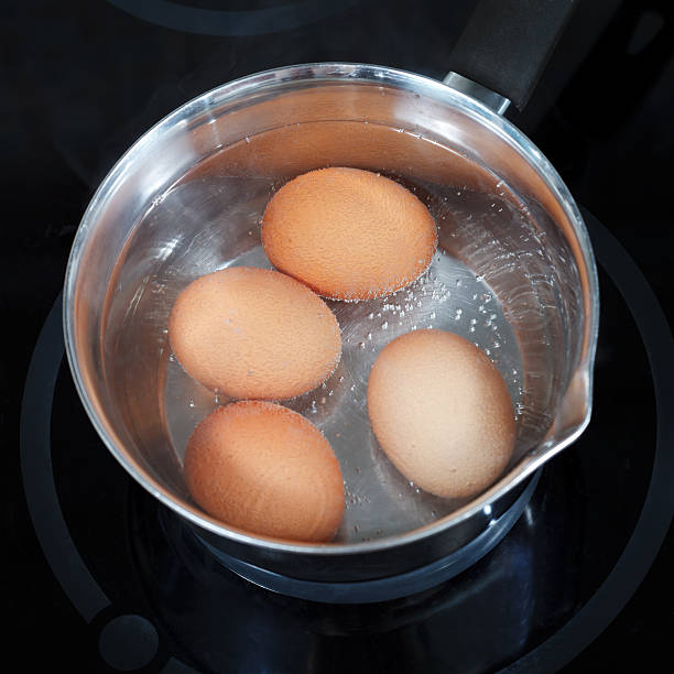 istock top view of boiling chicken eggs in metal pot 455276403