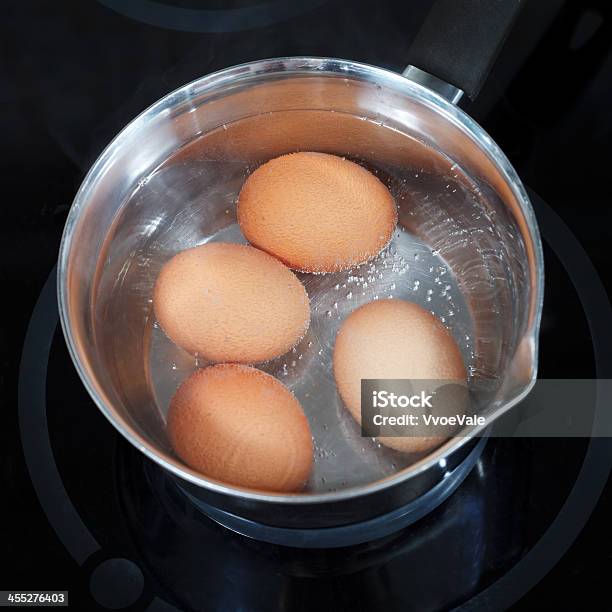 Top View Of Boiling Chicken Eggs In Metal Pot Stock Photo - Download Image Now - Boiling, Directly Above, Water