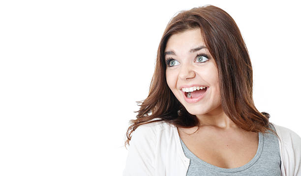 istock happy young female looking sideways 455288365