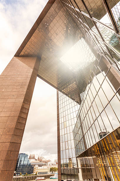 istock London - modern architecture glass facade with sun reflection 455292967