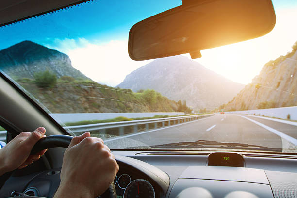 istock hands of driver on the steering wheel 455297955