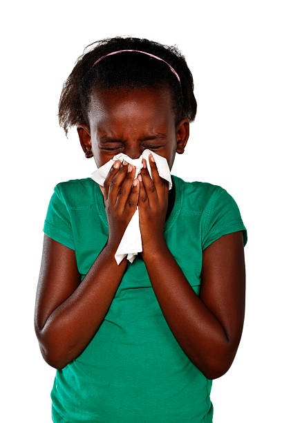 giovane afro-americano bambino soffiarsi il naso. - gregg foto e immagini stock