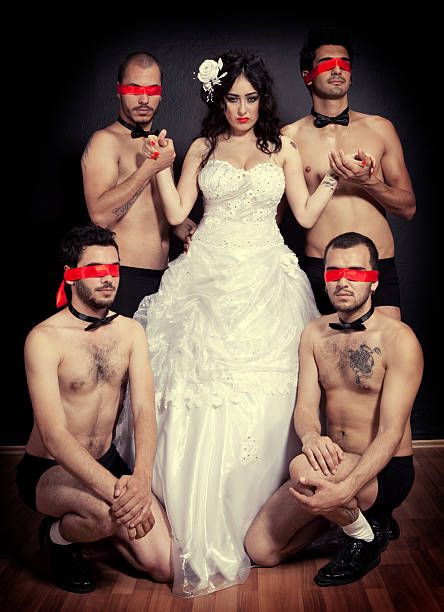 vier eine braut und bräutigam - female with group of males men women bizarre stock-fotos und bilder