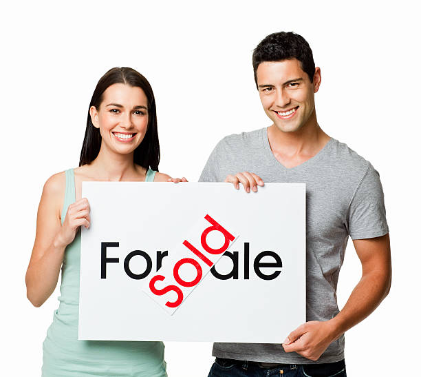 istock Young Couple Selling a Home - Isolated 455576995