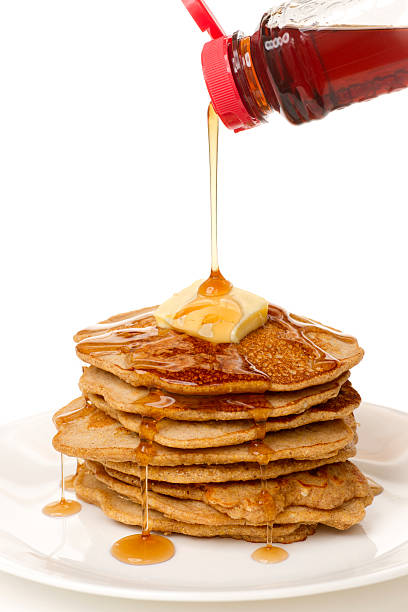 stack of pancakes with butter and syrup