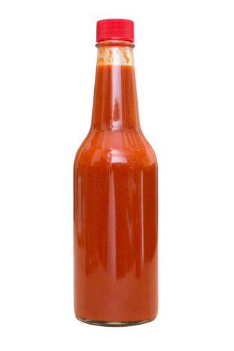 Spicy hot sauce isolated on white background