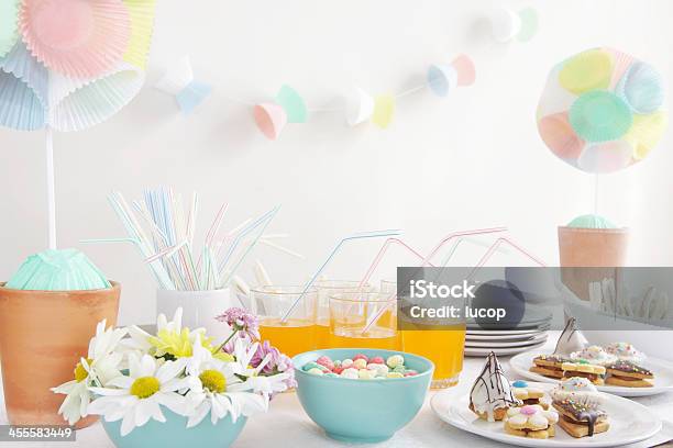 Party Table With Daisies Cupcake Liner Topiary And Garlands Stock Photo - Download Image Now