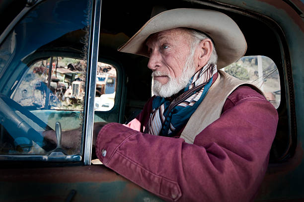 istock Cowboy in an old truck 455586575