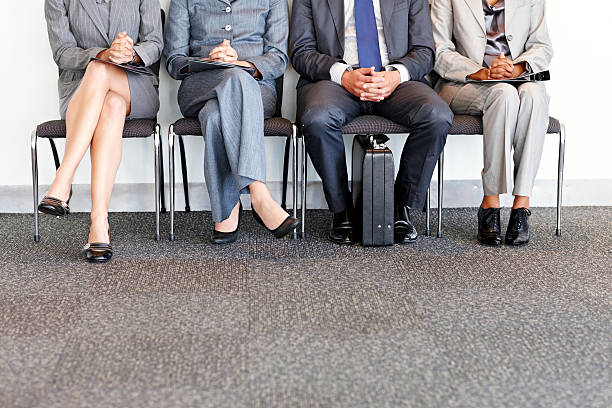 istock Business People Waiting in Chairs 455586795