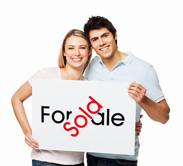 istock Young Couple With a New Home - Isolated 455597947