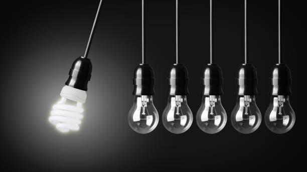 istock Eco friendly light bulb with row of Edison light bulbs 455600711