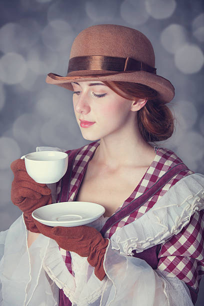istock Beautiful redhead women with cup of tea. 455604909
