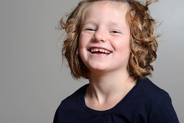 istock laughing little girl portrait 455608149