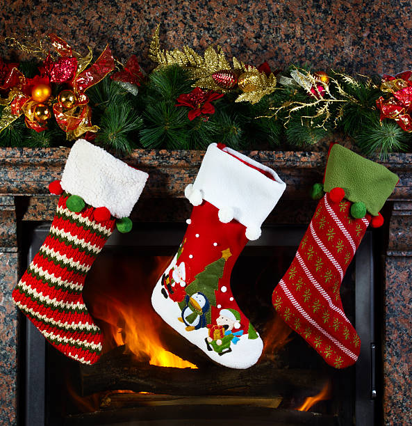 Christmas stocking Christmas stocking on fireplace background nylon stock pictures, royalty-free photos & images