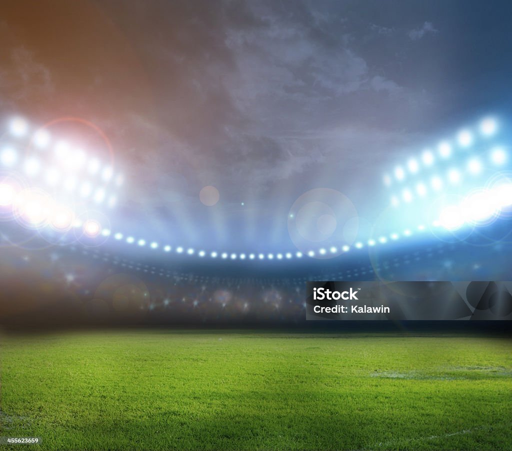 Bright stadium lights illuminating field at night stadium lights Rugby - Sport Stock Photo