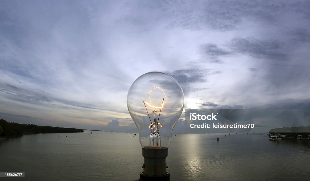 lightbulb on beautiful sky background the lightbulb on beautiful sky background Backgrounds Stock Photo