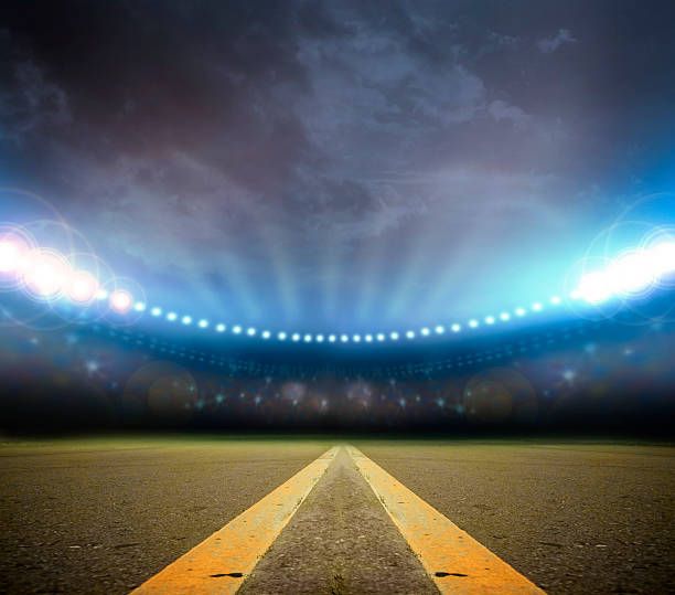 istock A stadium lit up with a road coming down the middle 455627217