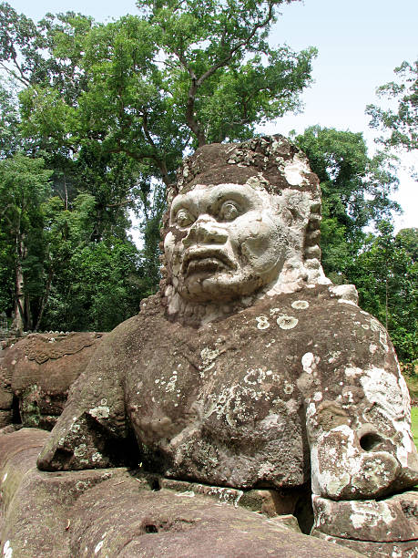 istock Mythological giants on the naga bridge, Preah Khan, Angkor 455627835