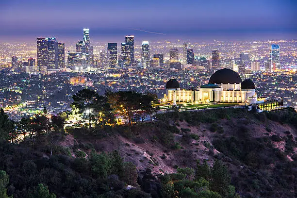 Griffith Obervatory and Downtown Los Angeles, California, USA skyline at dawn.