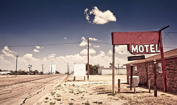 An old motel on a dirt road in the middle of nowhere Old motel sign on Route 66, USA route 66 sign old road stock pictures, royalty-free photos & images