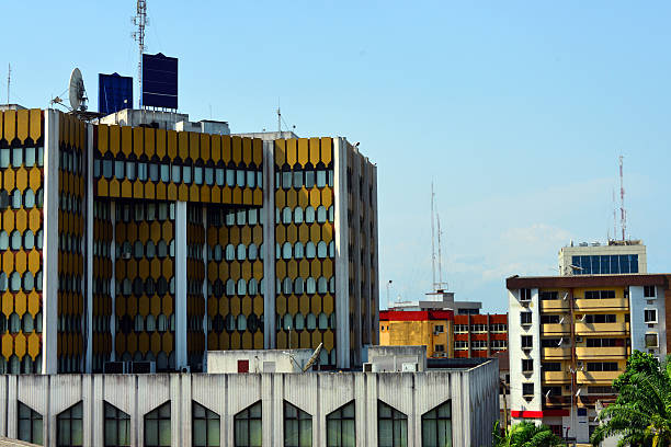 Douala, Cameroon: business district buildings Cameroon, Douala: business district buildings - office tower - facade with golden panels - BICEC bank building - photo by M.Torres cameroon stock pictures, royalty-free photos & images
