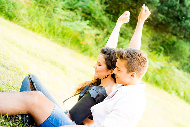 istock Young couple  with digital tablet in nature 455642559
