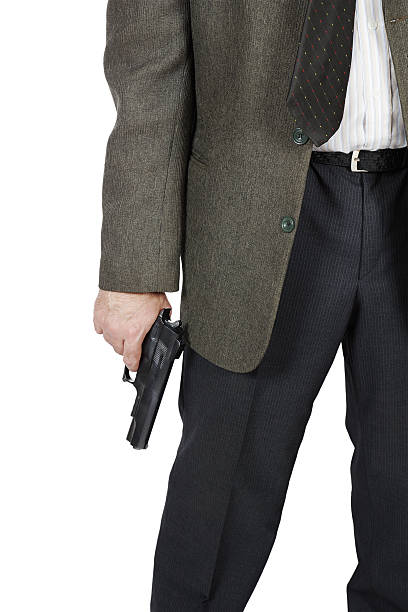 istock Man with a pistol in his hand 455648581