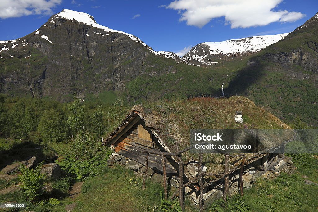 Old hut farm in Norway green Mountains - Geiranger Abandonated Norwegian hut, located on the trail that goes to Skagefla farm. Geiranger, Norway. Home Interior Stock Photo