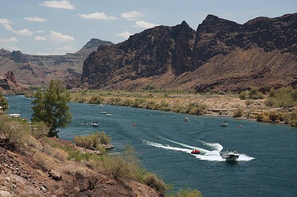 I took this picture south to lake Havasu, during a sunny and hot afternoon. The Colorado river widing between reddish mountain seemed so blue.
