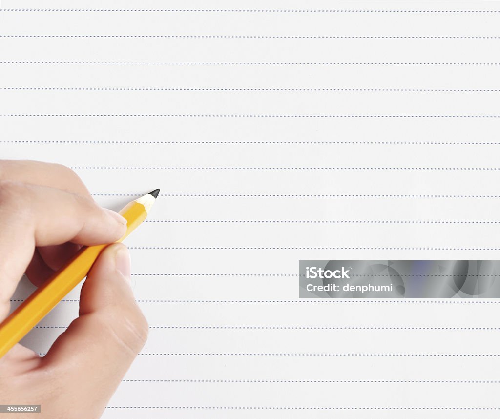 pencil in hand rubber writting something pencil in the hand rubber writting something Achievement Stock Photo