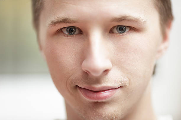 istock close up portrait of young man 455660077