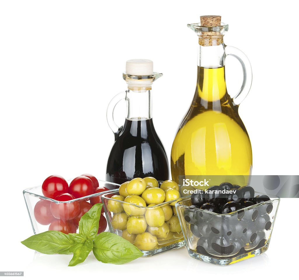 Olives, tomatoes, herbs and condiments Olives, tomatoes, herbs and condiments. Isolated on white background Appetizer Stock Photo