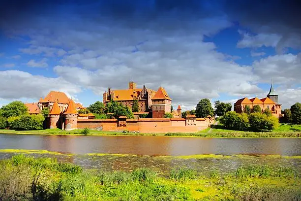 Malbork castle in Pomerania region of Poland. UNESCO World Heritage Site. Teutonic Knights' fortress also known as Marienburg. Nogat river.