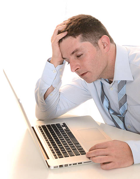 istock Stressed and Overworked Businessman with headache 455666913