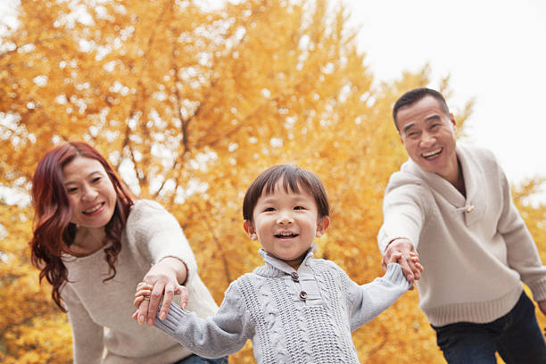 istock Family Walking in the Park 455669381