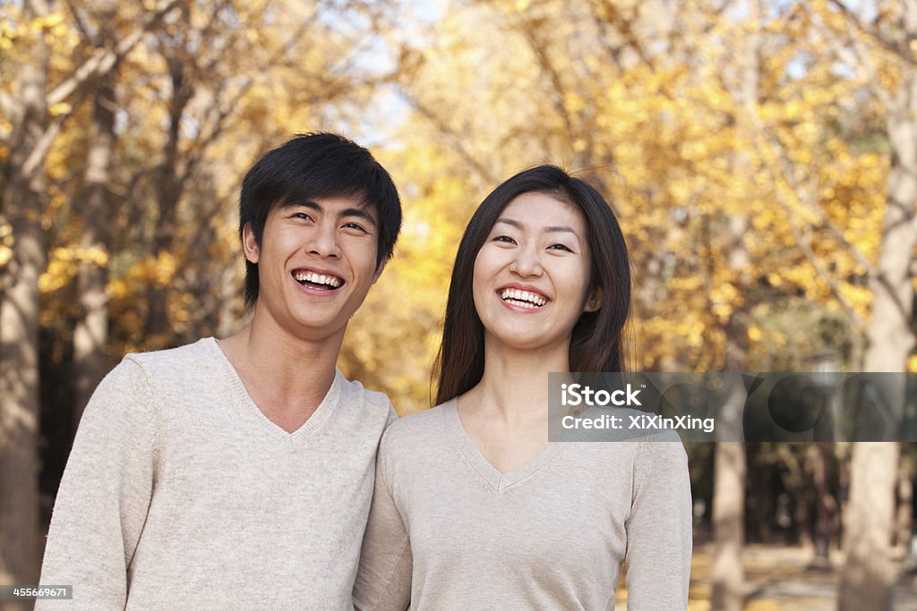 Young Couple in the Park Young Couple in the Park in Autumn 20-24 Years Stock Photo